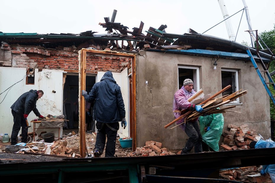 People clear the rubble of a house destroyed by a Russian strike in Korostyshiv, Zhytomyr region, Ukraine, Sunday, May 25, 2025. (AP Photo/Evgeniy Maloletka)