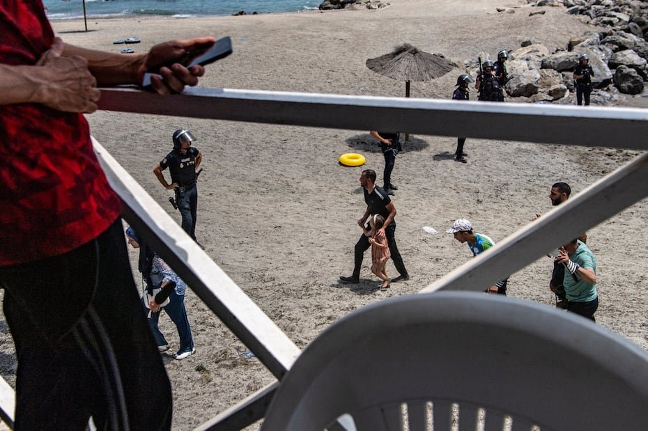 Migrants arrive after crossing from Morocco into the Spanish enclave of Ceuta, Thursday, July 30, 2026. (AP Photo/Antonio Sempere)